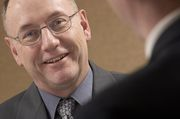 Gentleman providing sample interview answers to a job seeker